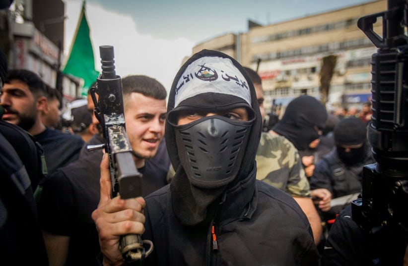  Palestinian gunmen and mourners attend the funeral of five Palestinians who were killed by the Israeli army during a military operation, in the West Bank city of Nablus, October 25, 2022.  (photo credit: NASSER ISHTAYEH/FLASH90)