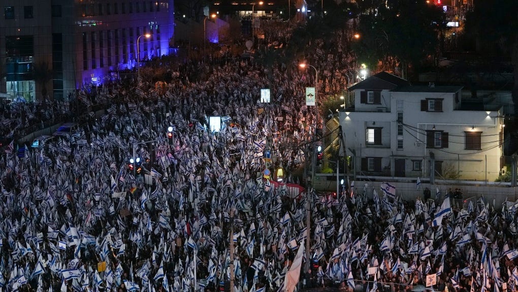 Tens of thousands of Israelis protest against plans by Prime Minister Benjamin Netanyahu's new government to overhaul the judicial system, in Tel Aviv, Israel, Saturday, March 4, 2023. (AP Photo/Tsafrir Abayov)